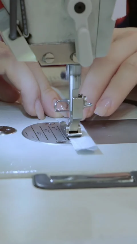 Skilled Hands Guide Fabric Through Automated Garment Technology Stock Footage 341068733