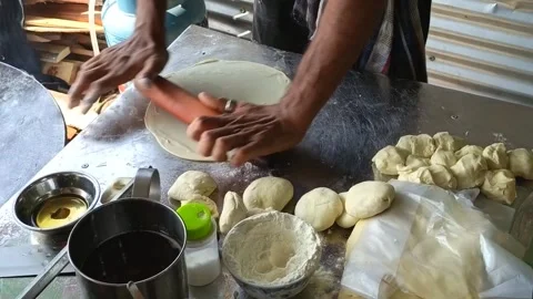 Skilled hands preparing fresh dough for traditional flatbreads Stock Footage 324606879