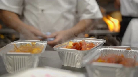 Skilled Indian chef prepares authentic takeaway Stock Footage 167269408