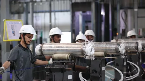 Skilled Industrial Technicians in Working on Assembly a Electric Motor Stock Footage 328521138