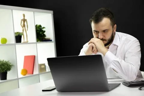 Skilled IT professional workis on project updating software improving code 库存照片