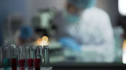 Skilled lab assistant conducting genetic examination to establish paternity Stock Footage 73954291