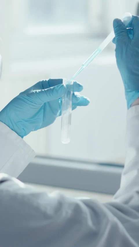 A skilled lab researcher analyzes samples with advanced data visualization Stock Footage 293209671