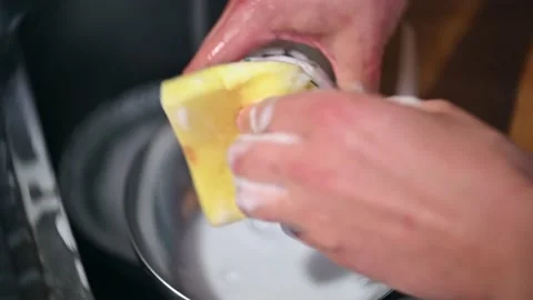 Skilled man Hands Gracefully Wash Dishes with Soapy Sponge Stock Footage 232798150