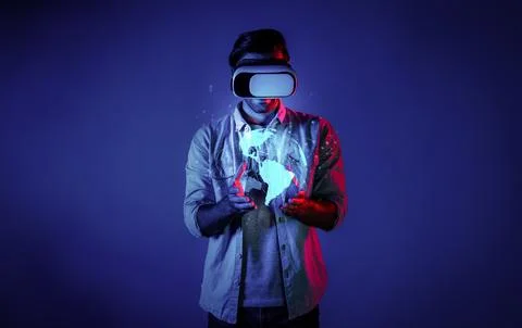 Skilled man using VR goggle to connect global network connection. Deviation. Fotos Stock