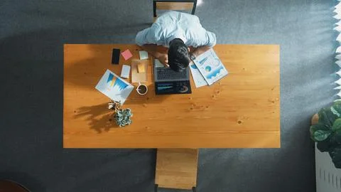 Skilled manager working on laptop while looking at data analysis. Convocation. Stock Photos