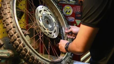 Skilled Mechanic Working on a Bicycle in a Workshop Stock Footage 248598222