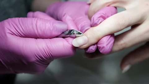 Skilled nail technician using electric manicure drill to remove gel coating Stock Footage 326251688