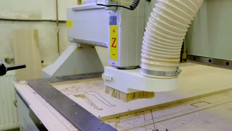 Skilled operator operates numerically controlled machine Stock Footage 135443291