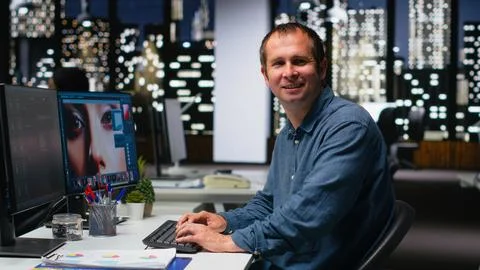 Skilled photo editor working on creative editing and generating content Stock Photos