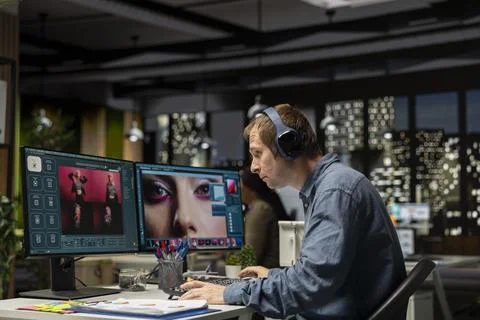 Skilled photo editor working on creative editing and generating content Stock Photos
