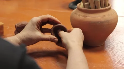 Skilled potter. Crafting handiwork. Shaped sculpture. Artistic finger. Ceramics Stockbeeldmateriaal 254104010