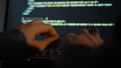 Skilled programmer intensely writes code artificial intelligence system thei Video stock 331462836