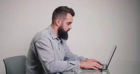 Skilled programmer writes code for website on laptop Video stock 197466340