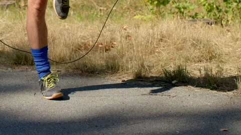 Skilled ropeskipping performance, man practicing jump rope Stock Footage 320956005