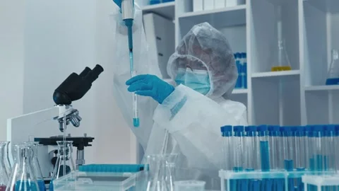 A skilled scientist is engaged in conducting highprecision experiments within a Stock Footage 317027441