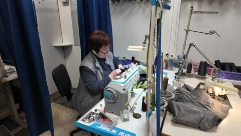 Skilled Seamstress at Work in a Small Tailor Shop Stock Footage 302204262