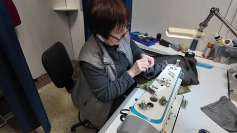 Skilled Seamstress at Work in a Small Tailor Shop Stock Footage 302204275
