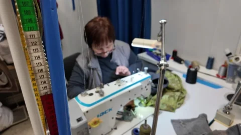 Skilled Seamstress at Work in a Small Tailor Shop Stock Footage 302204311