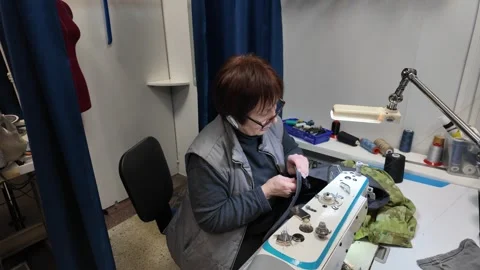 Skilled Seamstress at Work in a Small Tailor Shop Stock Footage 302204322