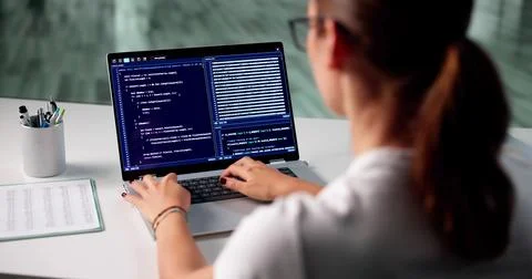 Skilled Software Developer Typing On Laptop In Modern Office Space. 스톡 사진