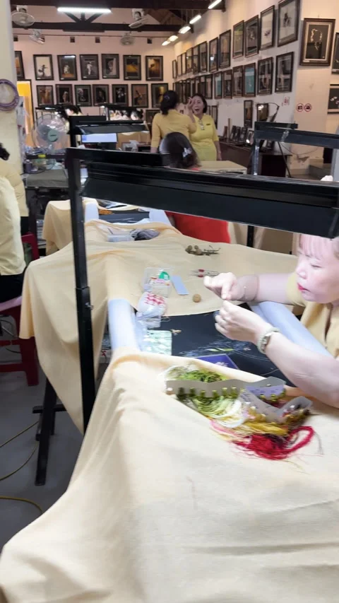 Skilled Vietnamese artisans creating intricate silk embroidery in a  workshop Stock-Footage 341751281