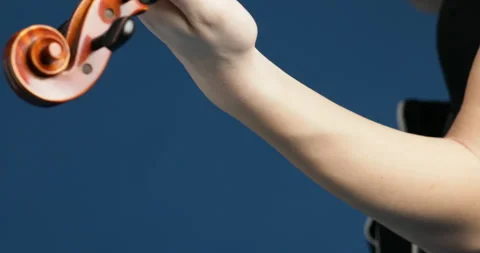 Skilled violinist's technique transforms notes into deep emotion Stock Footage 271324685