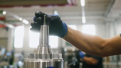 Skilled Worker Assembling Precision Part - Factory Floor - Close-up Stock Footage 288872680