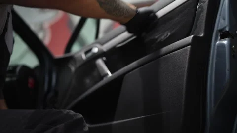 Skilled worker in black gloves carefully applying cleaning solution with a .. Stock Footage 340517943