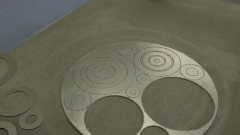 A skilled worker in blue measures the dimensions of a part using a vernier Stock Footage 127056307