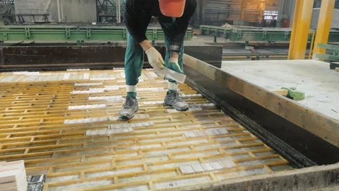 Skilled worker covers large concrete construction panel Stock Footage 124608312