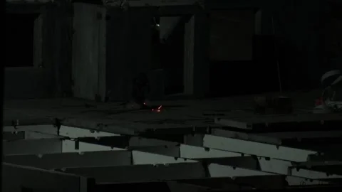 Skilled worker engaged in welding activity during night shift, sparks Stock Footage 325699050