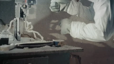 Skilled worker operating carefully. Specialist in protective gear meticulously Stock Footage 346475733