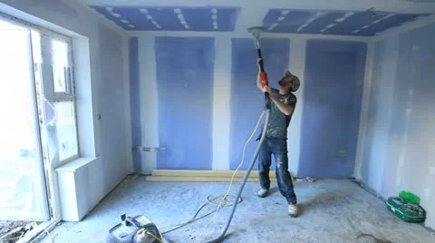 Skilled worker sanding down interior wall before emulsion being applied. Stock-Footage 12185184