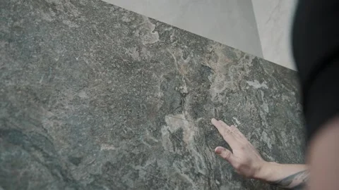 Skilled worker uses tools to create textured tile surfaces Video stock 317380134