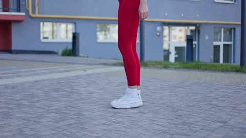 Skilled young sportswoman executing side squats at outdoors urban landscape Stock Footage 276437111