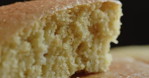 Skillet cornbread slice cross section 4K sliding video Stock Footage 250684125