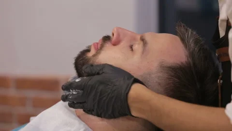 Skillful beautician preparing to shave stubble Stock Footage 93709953