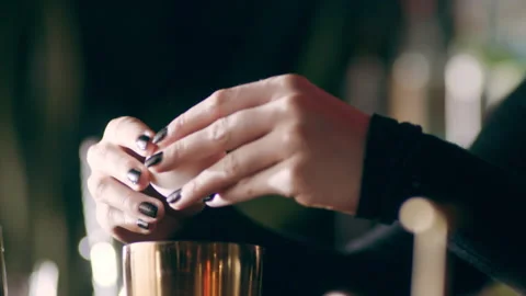 Skillful female bartender cracking an egg and separating the egg yolk from the w Video stock 199455906