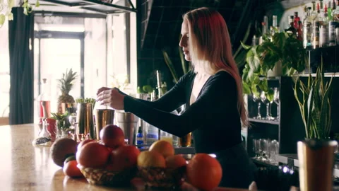 Skillful female bartender cracking an egg and separating the egg yolk from the w Stock Footage 199456839