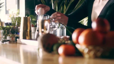 Skillful female bartender cracking an egg and separating the egg yolk from the w Stock Footage 199459452