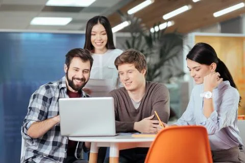 Skillful four colleagues planning strategy Stock Photos