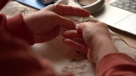 Skillful hands create beautiful embroidery in a bright workshop Stock Footage 318903713