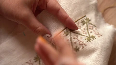 Skillful hands create beautiful embroidery in a bright workshop Stock Footage 327059830
