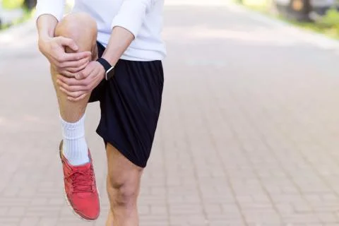 Skillful jogger preparing for running Stock Photos