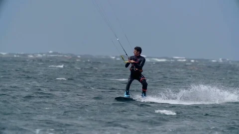 Skillful kitesurfer surfing in the sea Video stock 108628126