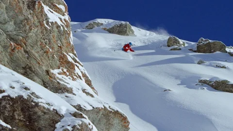 Skillful skier making turns while skiing snowy downhill Stock Footage 116740125