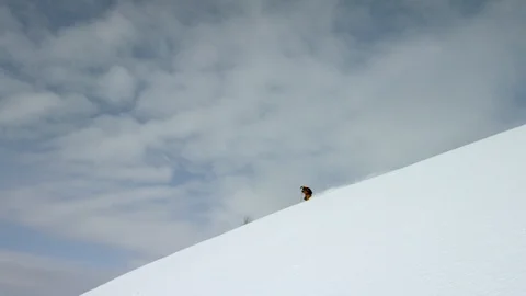 Skillful skiers skiing down the slope of snow capped Video stock 116786839