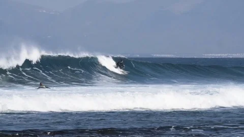 Skillful surfer riding a big wave Stock Footage 71537523