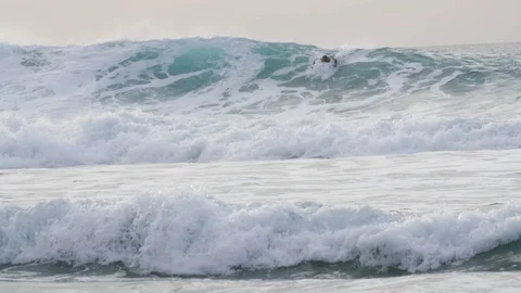 Skillful Surfer riding a big wave Stock Footage 71540910